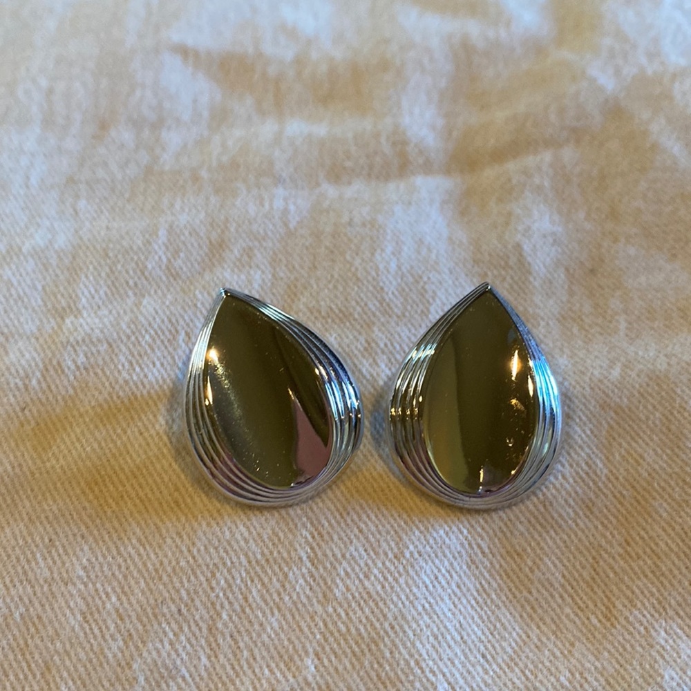 Silver tear shaped earrings.